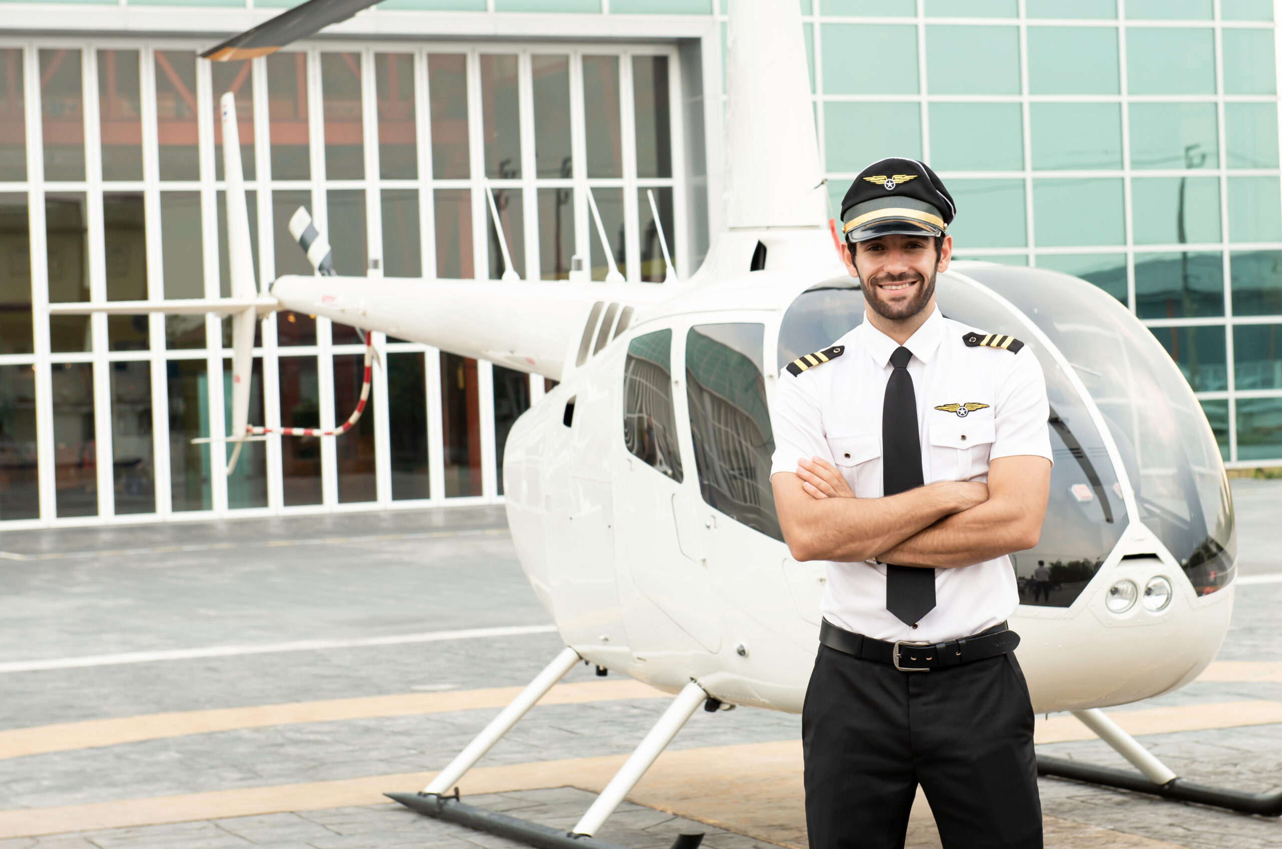 Handsome,Caucasian,Pilot,In,White,Shirt,Uniform,And,Hat,Standing
