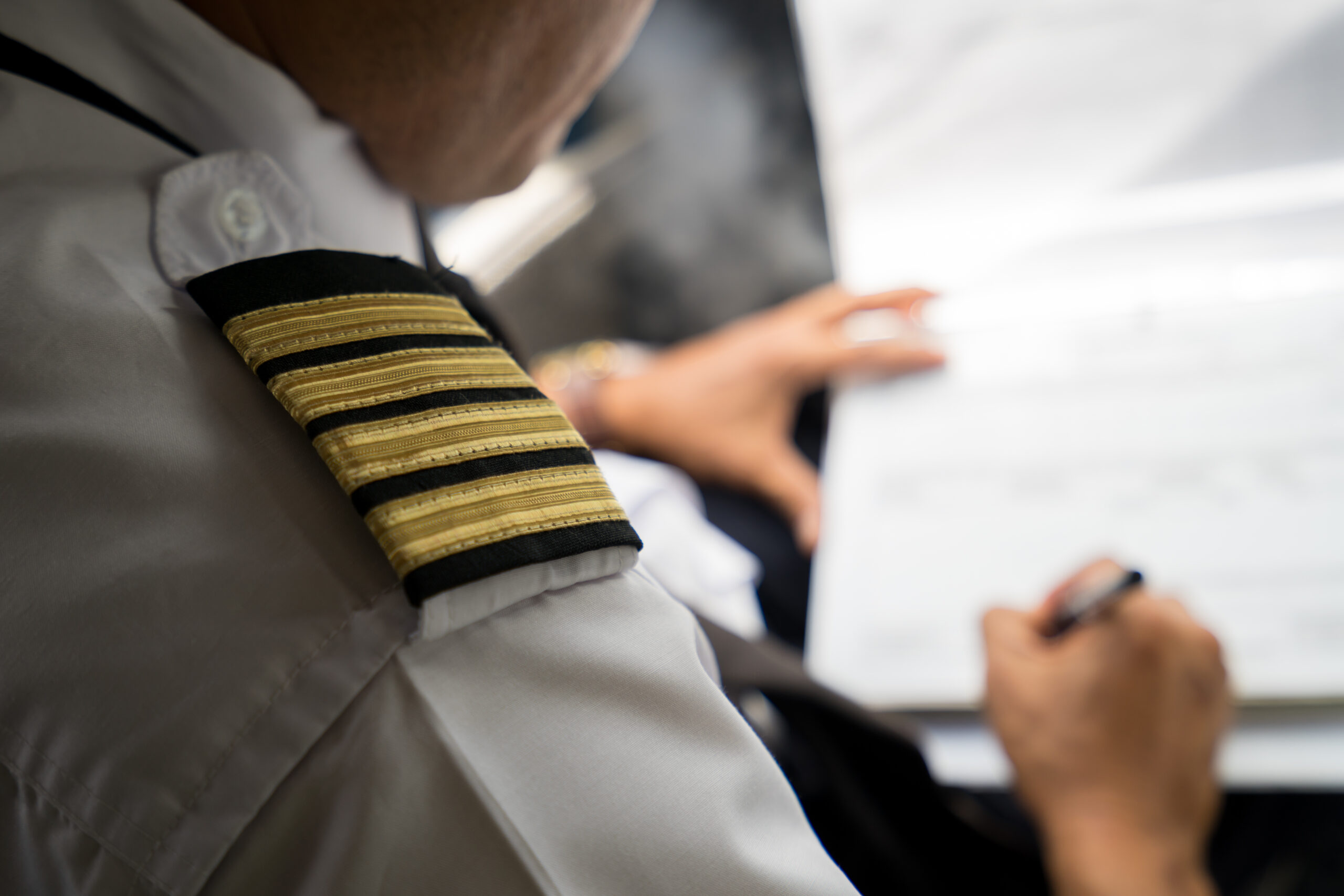Captain,In,The,Aircraft,Cockpit,Writing,A,Report,After,Flight.